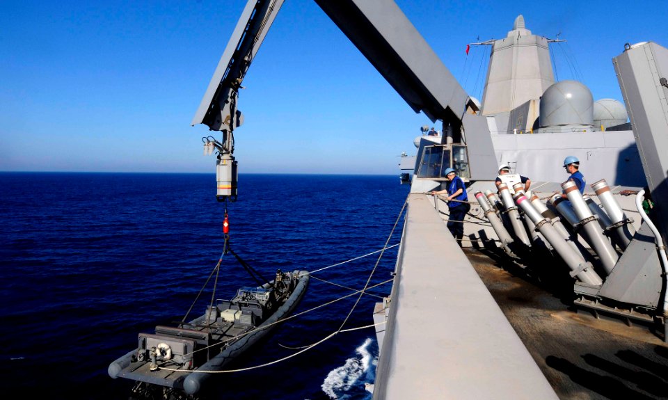 US Navy 110618-N-OS574-243 Sailors lower a rigid-hull inflatable boat aboard the San Antonio-class amphibious transport dock ship USS Mesa Verde (L