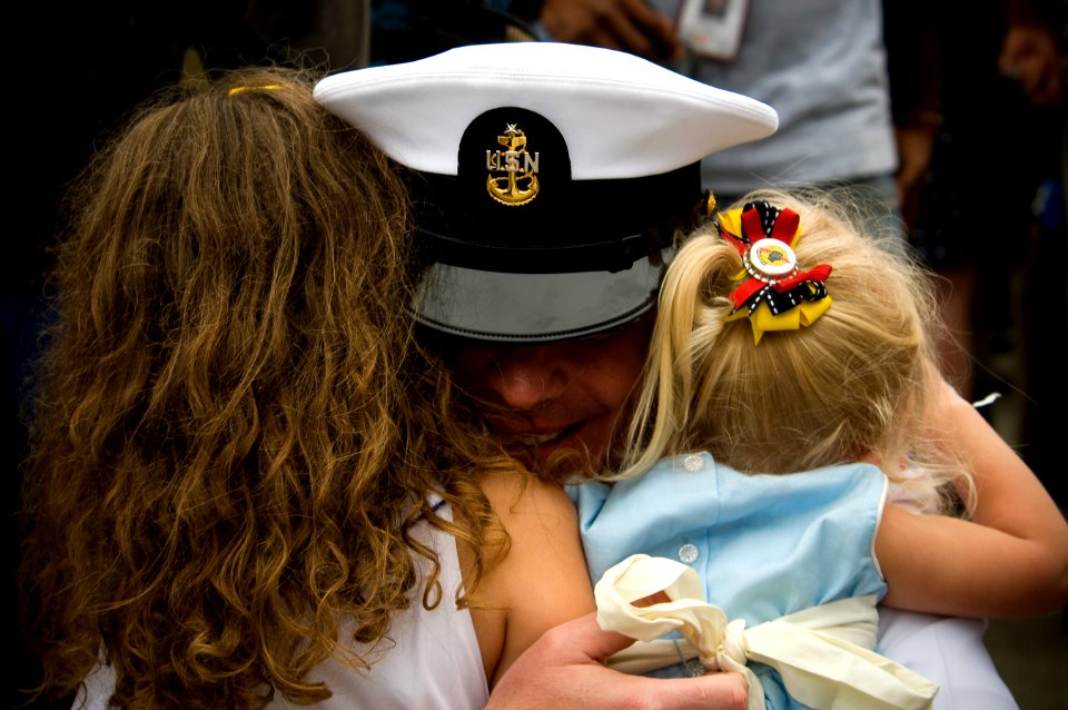 US Navy 110615-N-MD252-443 A Sailor is welcomed home by family members after returning to Naval Base Coronado