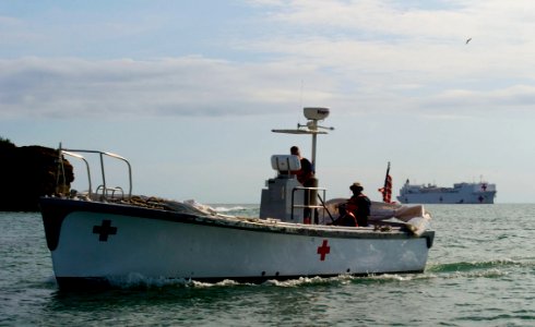US Navy 110617-N-RM525-507 A motor whale-boat leaves the Military Sealift Command hospital ship USNS Comfort (T-AH 20) as the ship is anchored off