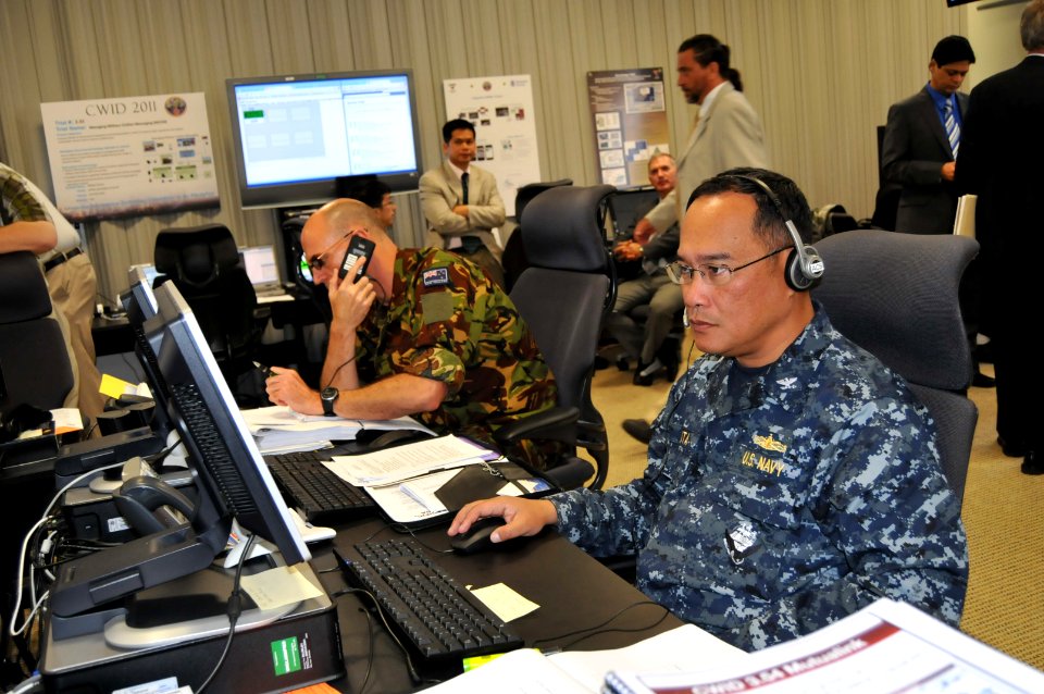 US Navy 110615-N-UN340-035 Space and Naval Warfare Systems Command (SPAWAR) reserve component officer Capt. Dan Gruta, right, and New Zealand army