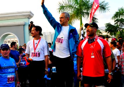 US Navy 110618-N-KB563-188 Dr. Jose Ramos-Horta, President of Timor-Leste, center, waves to the crowd as Capt. Jesse A. Wilson watches the start of