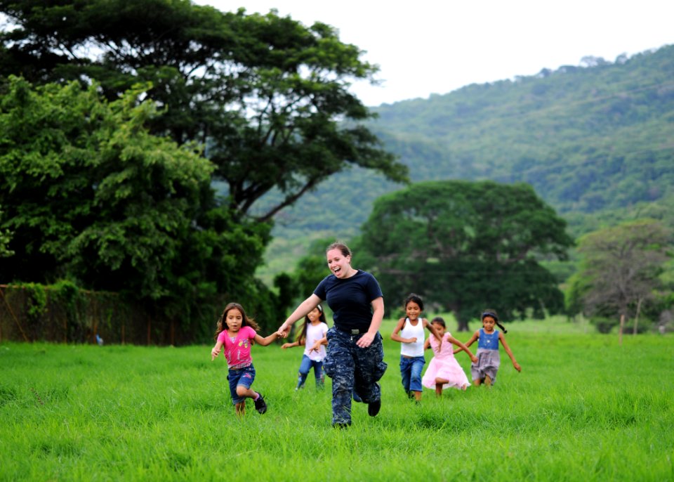 US Navy 110620-N-NY820-615 Hospitalman Jamie Lee entertains children at the Centro Civico medical site during a Continuing Promise 2011 medical com