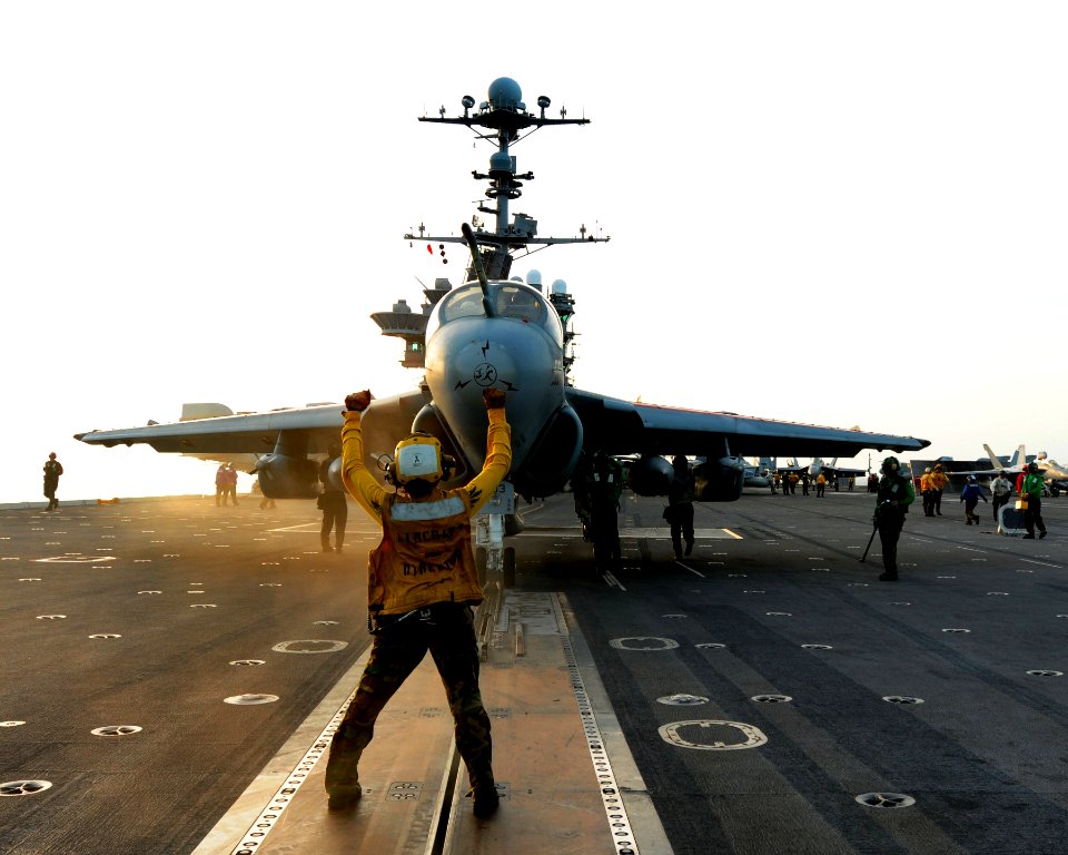 US Navy 110621-N-DS193-061 Aviation Boatswain's Mate (Handling) 3rd Class Chiva Jones directs an EA-6B Prowler assigned to the Gauntlets of Electr