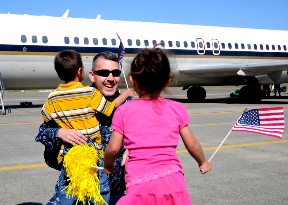 US Navy 110615-N-ZK021-002 A Sailor assigned to the Garudas of Electronic Attack Squadron (VAQ) 134 is welcomed home by his children during a homec