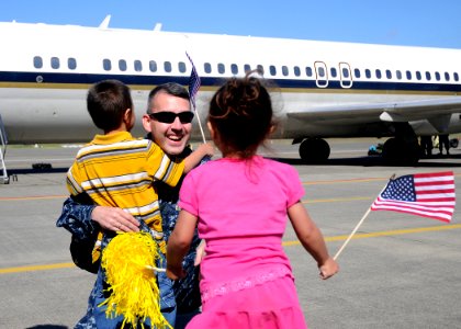 US Navy 110615-N-ZK021-002 A Sailor assigned to the Garudas of Electronic Attack Squadron (VAQ) 134 is welcomed home by his children during a homec