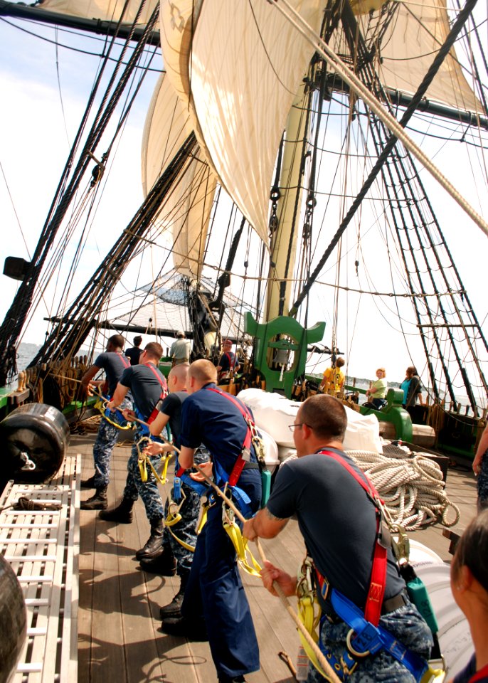 US Navy 110619-N-AU127-377 Sailors assigned to USS Constitution heave a line during sail training aboard Friendship of Salem