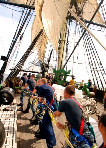 US Navy 110619-N-AU127-377 Sailors assigned to USS Constitution heave a line during sail training aboard Friendship of Salem