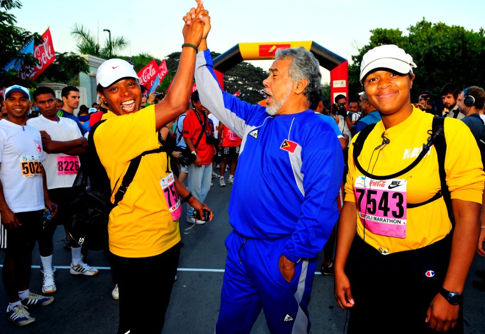 US Navy 110618-N-KB563-161 Xanana Gusmao, the Prime Minister of Timor-Leste, high fives Cmdr. Veronica Armstrong during the Marathon for Peace race