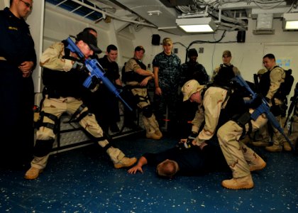 US Navy 110620-N-NL541-107 Members of the visit, board, search and seizure (VBSS) team aboard the guided-missile frigate USS Thach (FFG 43) demonst photo
