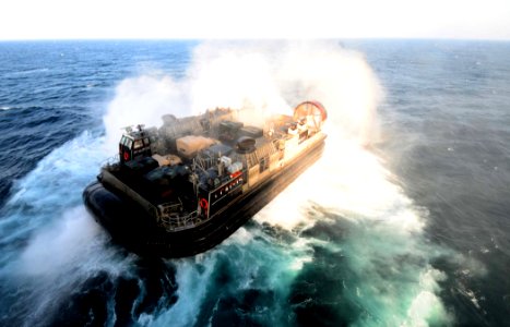 US Navy 110621-N-EC658-026 A landing craft air cushion exits the well deck of USS Bataan (LHD 5)