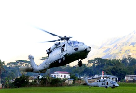 US Navy 110619-N-BC134-015 MH-60S Sea Hawk helicopters assigned to Helicopter Sea Combat Squadron (HSC) 23 transfer personnel to support a Pacific