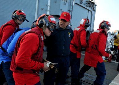 US Navy 110617-N-NL541-024 Culinary Specialist 1st Class Lucio Diaz, assigned to the guided-missile frigate USS Thach (FFG 43), offers guidance to