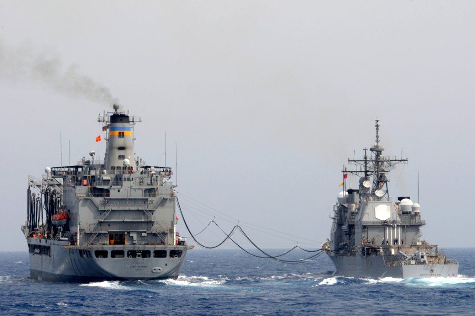 US Navy 110620-N-XQ375-184 The guided-missile cruiser USS Gettysburg (CG 64), right, conducts a refueling at sea with the Military Sealift Command