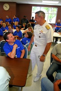 US Navy 110617-N-ZL585-192 Rear Adm. Thomas A. Cropper, commander of Strike Force Training Pacific, meets with employees of Cobham Mission Systems