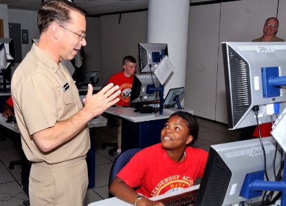 US Navy 110622-N-IK959-076 Rear Adm. David F. Steindl talks to a Navy JROTC cadet ensign during the 2011 NJROTC Leadership Academy photo