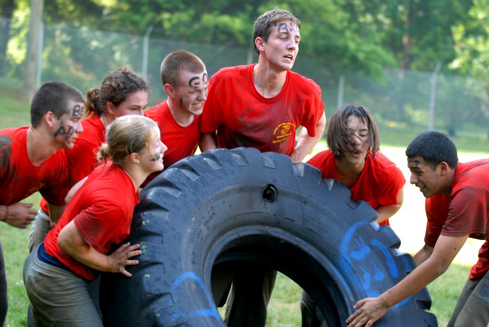 US Navy 110621-N-OA833-005 High school students participate in a tire-rolling race during the 2011 U.S. Naval Academy Summer Seminar Sea Trials