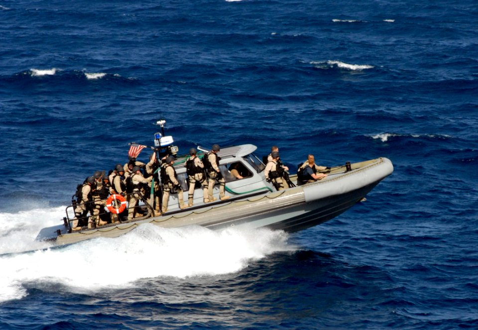 US Navy 110621-N-GH121-467 The visit, board, search and seizure team assigned to USS Whidbey Island (LSD 41) returns to the ship after boarding Cas