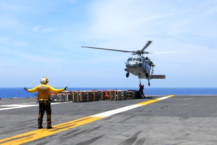 US Navy 110619-N-AW206-018 Flight Deck Director Aviation Boatswain's Mate (Handling) Resty Amo, from Manila, Philippines
