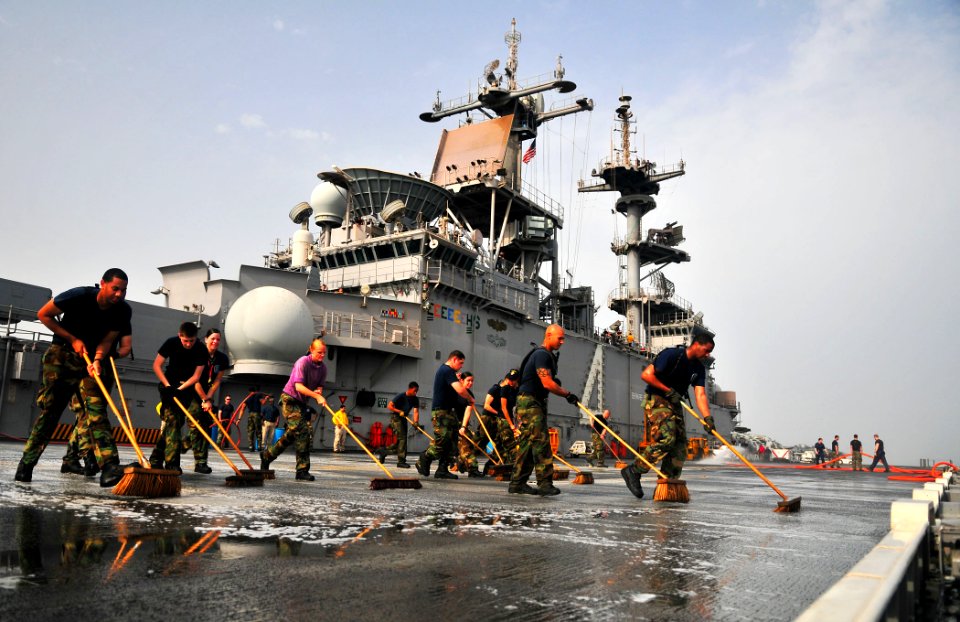 US Navy 110623-N-ZS026-250 Sailors scrub the flight deck during a fresh-water washdown aboard USS Boxer (LHD 4)