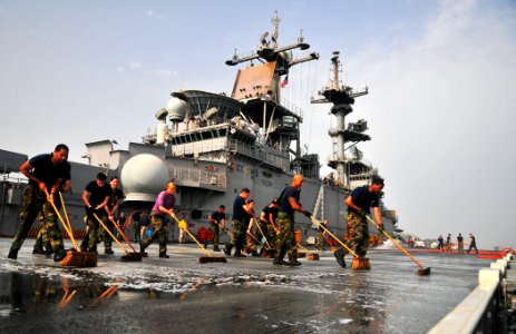 US Navy 110623-N-ZS026-250 Sailors scrub the flight deck during a fresh-water washdown aboard USS Boxer (LHD 4)