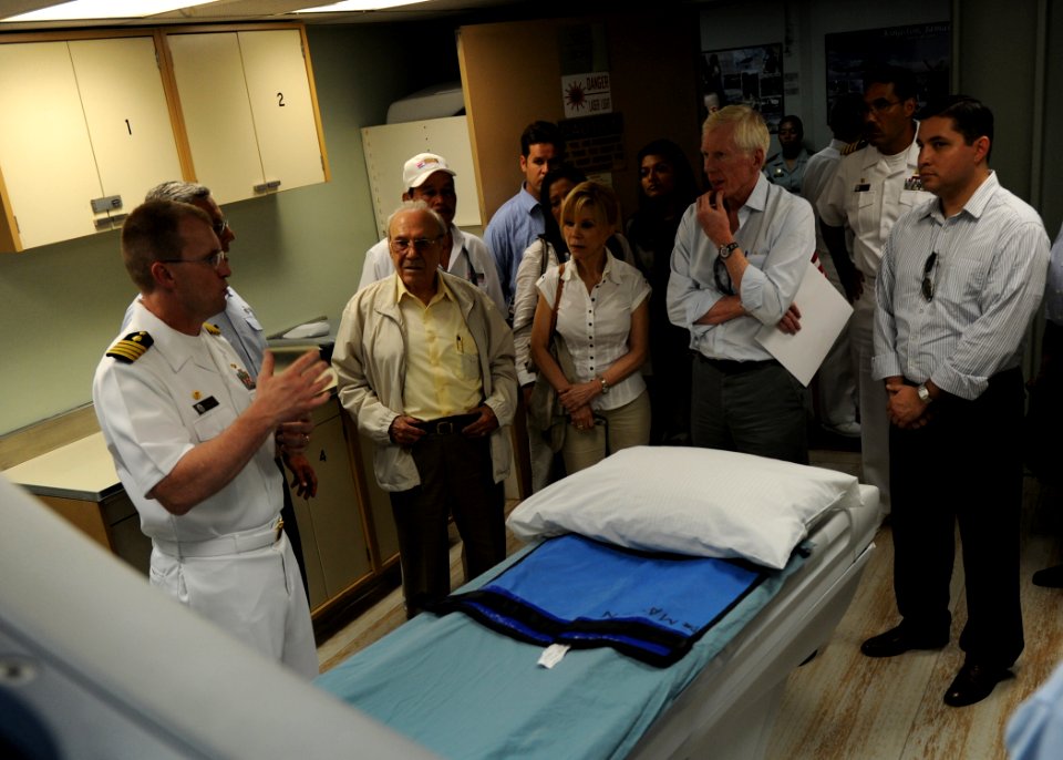 US Navy 110620-N-QD416-081 Capt. David Weiss, left, commanding officer of the medical treatment facility aboard the Military Sealift Command hospit