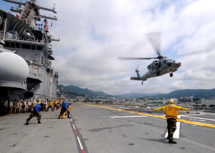 US Navy 110621-N-SO729-035 An MH-60S Sea Hawk helicopter prepares to land aboard USS Essex (LHD 2)