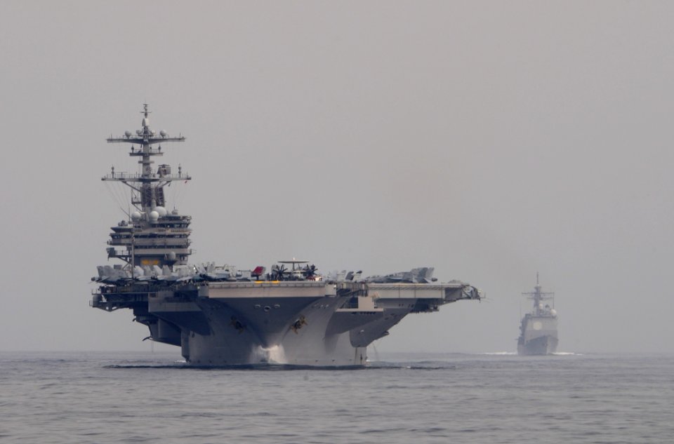 US Navy 110621-N-XQ375-327 USS George H.W. Bush (CVN 77), left, and USS Gettysburg (CG 64) transit the Gulf of Aden