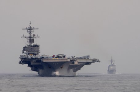 US Navy 110621-N-XQ375-327 USS George H.W. Bush (CVN 77), left, and USS Gettysburg (CG 64) transit the Gulf of Aden