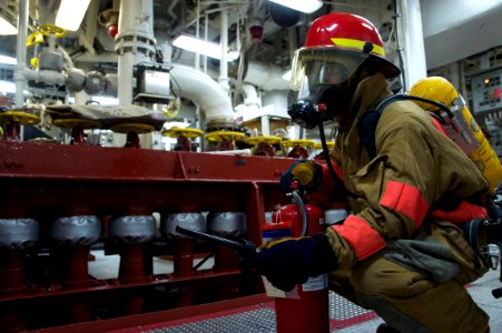 US Navy 110623-N-ZC343-016 A Sailor aboard USS Bonhomme Richard (LHD 6) sets a reflash watch during a main space fire drill