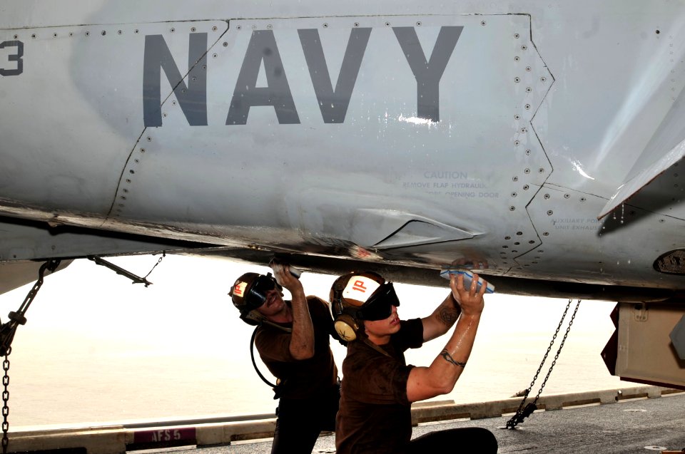 US Navy 110621-N-CH661-020 Sailors wash an F-A-18F Super Hornet assigned to the Red Rippers of Strike Fighter Squadron (VFA) 11 during a maintenanc