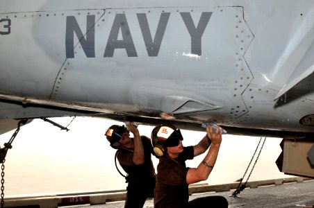 US Navy 110621-N-CH661-020 Sailors wash an F-A-18F Super Hornet assigned to the Red Rippers of Strike Fighter Squadron (VFA) 11 during a maintenanc
