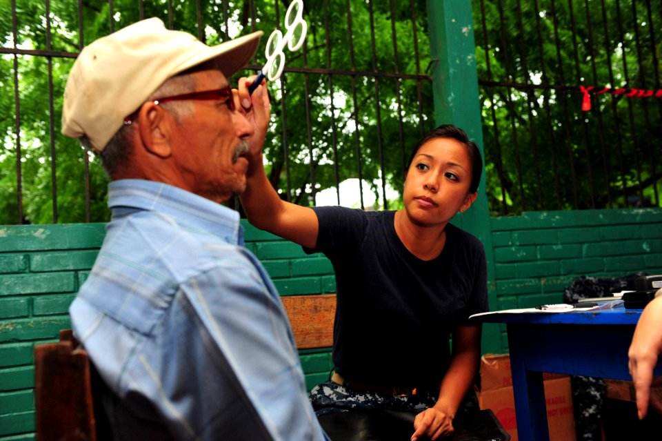 US Navy 110624-F-NJ219-103 Lt. Patricia Salazar, an optometrist from San Francisco, checks a patient's vision at the Humberto Mendez Rivas medical