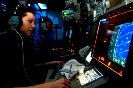 US Navy 110621-N-GL340-038 Cryptologic Technician (Technical) 3rd Shayna Ramsey monitors a radar in the combat direction center aboard USS Ronald R
