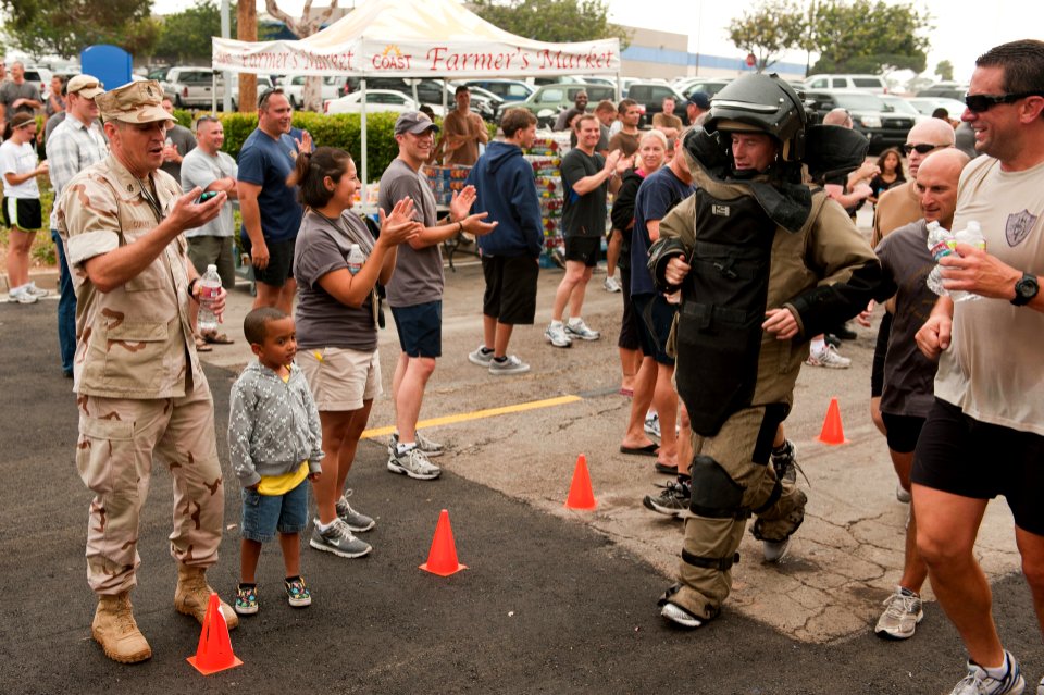 US Navy 110624-N-BT887-098 Lt. Cmdr. Kevin Childre finishes a 5K run-walk in a bomb suit at the 3rd annual Explosive Ordnance Disposal Group (EODGR
