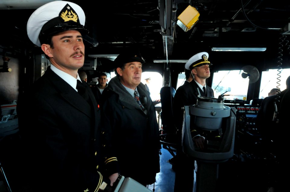US Navy 110624-N-NL541-097 Chilean navy retired Rear Adm. Ellis Berg, middle, acts as the local pilot for the guided-missile frigate USS Thach (FFG