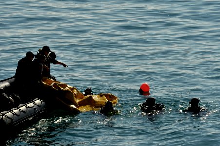 US Navy 110623-N-KB666-194 Navy divers and divers assigned to the Armada de Chile conduct a joint lift bag dive operation photo