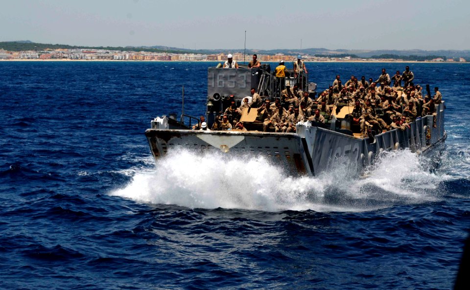 US Navy 110627-N-OS574-084 A landing craft utility prepares to off-load passengers and equipment onto USS Mesa Verde (LPD 19)