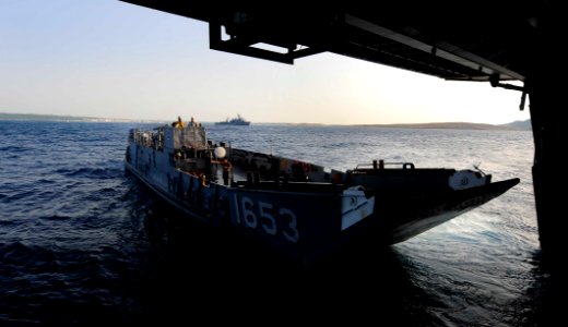 US Navy 110627-N-OS574-059 A landing craft utility departs to load passengers and equipment aboard USS Mesa Verde (LPD 19)