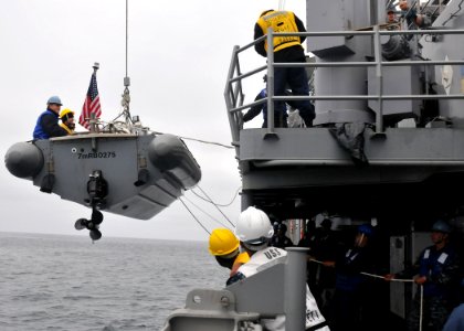 US Navy 110626-N-PB383-707 Sailors aboard USS McClusky (FFG 41) lower a rigid-hull inflatable boat during a four-day underway period