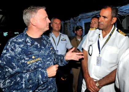US Navy 110625-N-CH661-056 Capt. Dee L. Mewbourne, commanding officer of the aircraft carrier USS Enterprise (CVN 65), talks to military officials
