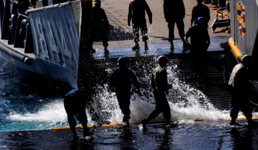 US Navy 110623-N-OS574-040 Sailors aboard the San Antonio-class amphibious transport dock ship USS Mesa Verde (LPD 19) prepare to load passengers a