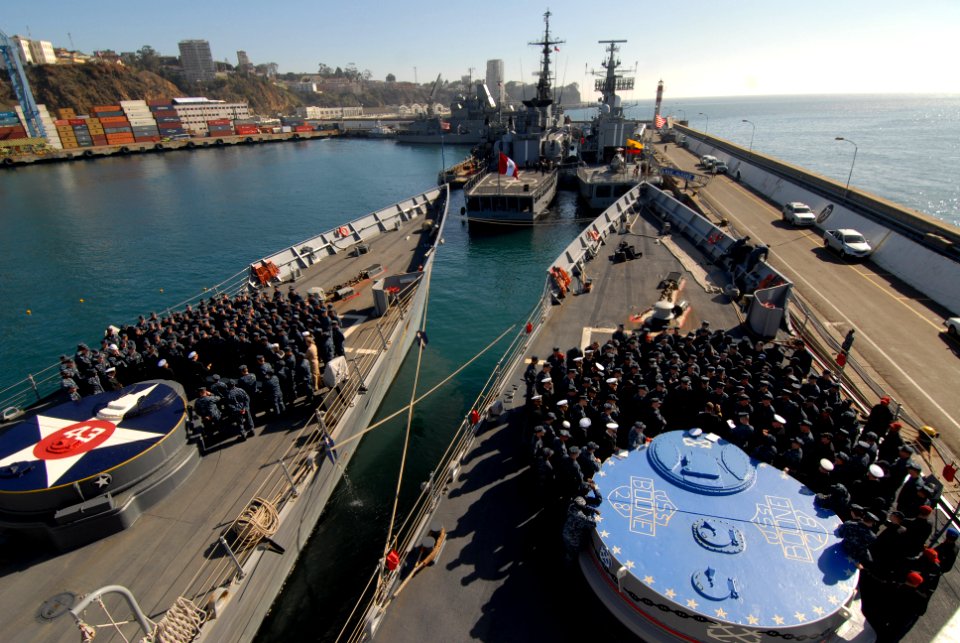 US Navy 110624-N-ZI300-087 Sailors aboard the guided-missile frigates USS Thach and USS Boone (FFG 28) gather on the foc'sle for a briefing after a