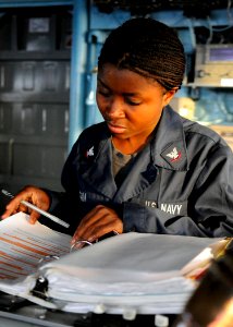 US Navy 110625-N-KB052-007 Boatswain's Mate 3rd Class Mercedes Logan studies for her enlisted surface warfare specialist (ESWS) qualification