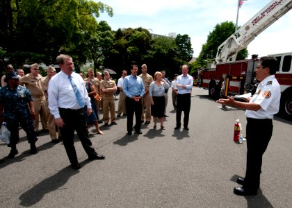 US Navy 110624-N-AG621-009 George Salcedo, asst. chief of prevention for the Fire Department at Commander, Naval Forces Japan Region, provides a br