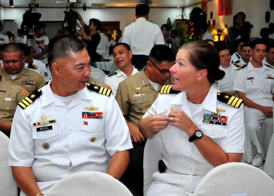 US Navy 110628-N-XR557-015 Cmdr. Andree Bergmann, commanding officer of the guided-missile destroyer USS Howard (DDG-83), speaks with Armed Forces