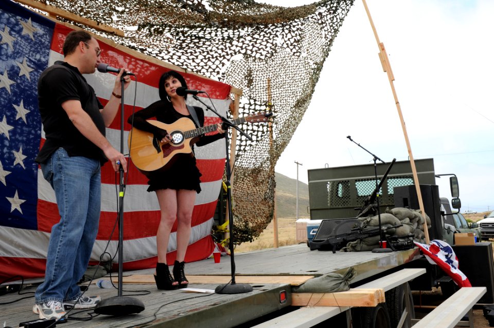 US Navy 110626-N-PM781-002 Lt. J.R. Guernsey performs a duet with musical artist Whitney Steele