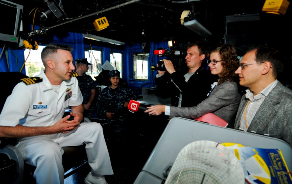 US Navy 110628-N-OM642-411 Cmdr. Patrick E. Kulakowski, commanding officer of the guided-missile frigate USS Carr (FFG 52), speaks with Russian med