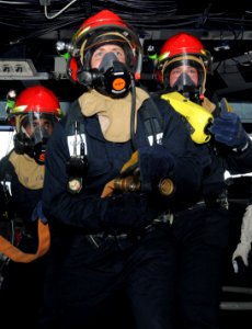 US Navy 110627-N-QL471-178 Sailors man a fire hose during a general quarters training exercise in the pilothouse aboard the aircraft carrier USS Ge photo