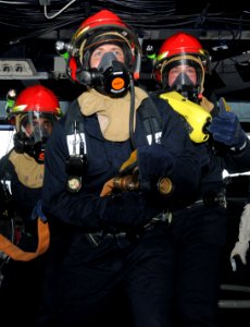 US Navy 110627-N-QL471-178 Sailors man a fire hose during a general quarters training exercise in the pilothouse aboard the aircraft carrier USS Ge