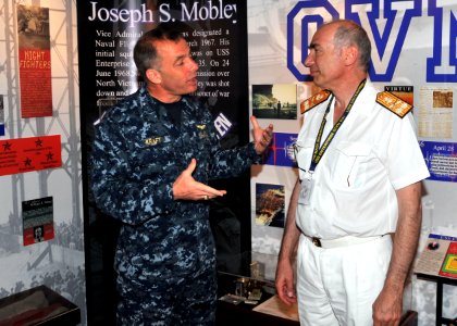 US Navy 110625-N-CH661-019 Rear Adm. Terry B. Kraft, commander of the Enterprise Carrier Strike Group, talks to military officials from Greece duri photo